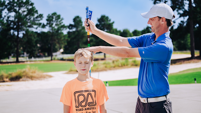 A young golfer goes through the U.S. Kids Golf fitting process.