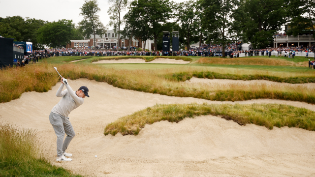 Matt Fitzpatrick plays a shot from a fairway bunker on the 18th hole during the final round of the 122nd U.S. Open Championship 