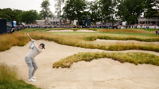 Matt Fitzpatrick plays a shot from a fairway bunker on the 18th hole during the final round of the 122nd U.S. Open Championship