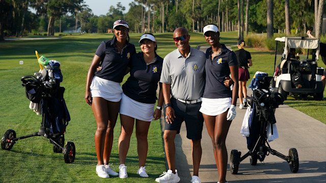 North Carolina A&T State University team poses with their Coach, Scooter Clark during the final round of the PGA WORKS Collegiate Championship.