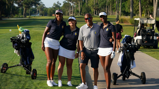 North Carolina A&T State University team poses with their Coach, Scooter Clark during the final round of the PGA WORKS Collegiate Championship.