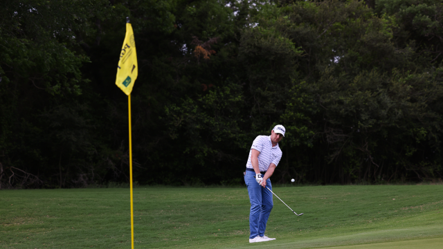 Alex Beach chips onto the 10th hole during a playoff for the final round of the 54th PGA Professional Championship. 