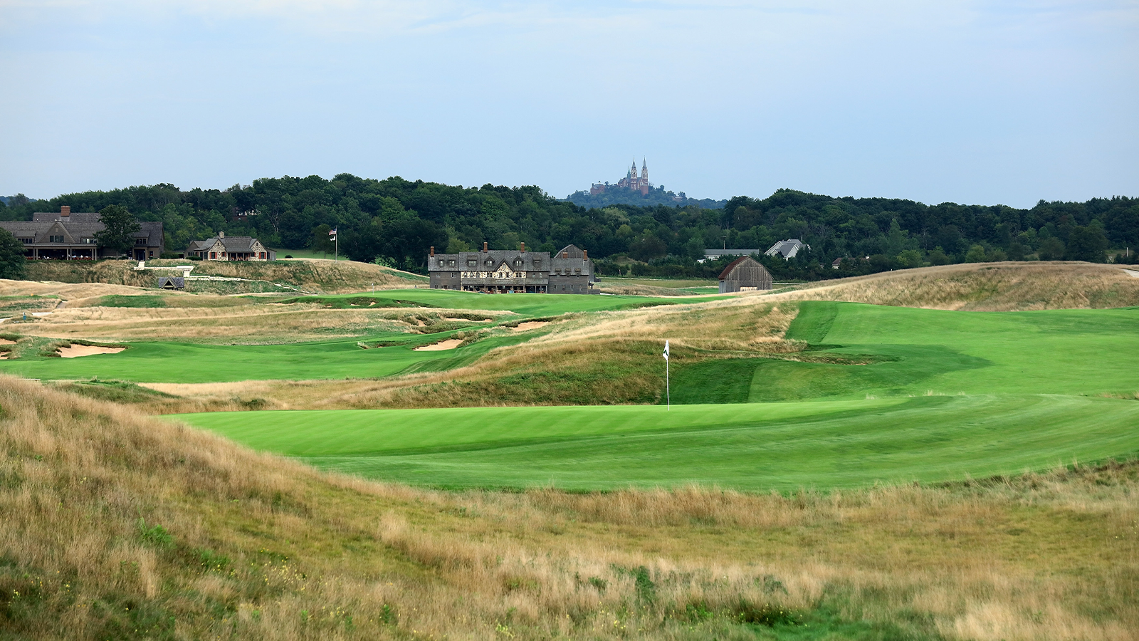 A view of the green on the 607 yards par 5, seventh hole with the 663 yards par 5, 18th hole behind looking towards the clubhouse at Erin Hills Golf Course the venue for the 2017 US Open Championship on August 30, 2016 in Erin, Wisconsin. (Photo by David Cannon/Getty Images)