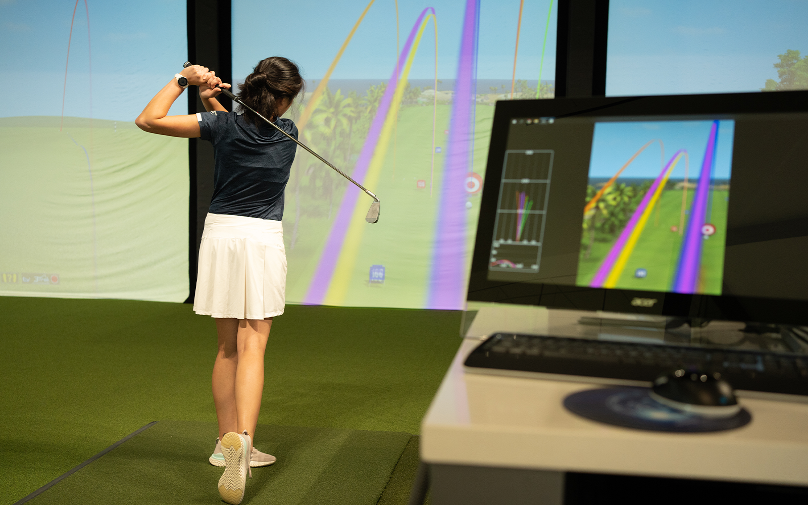 Player hits her shot inside the Indoor Golf Simulator at PGA Frisco Campus on August 17, 2022 in Frisco, Texas. (Photo by The Marmones LLC/PGA of America)

