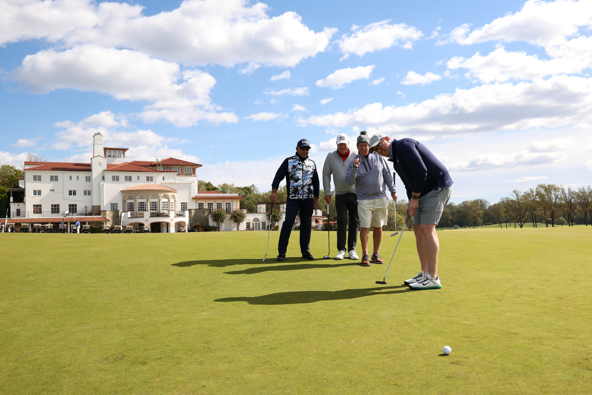 Venker hits a putt in the shadow of Congressional's clubhouse.