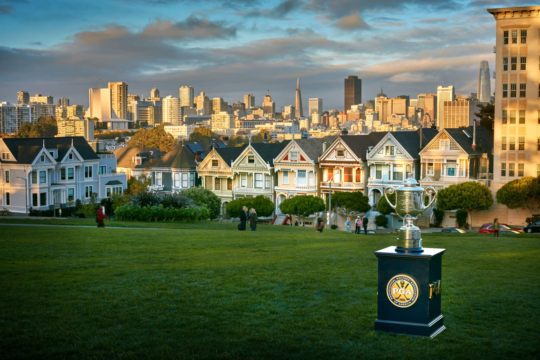 The Wanamaker Trophy in Alamo Square park with the famous "Painted Ladies" row of houses in the background.