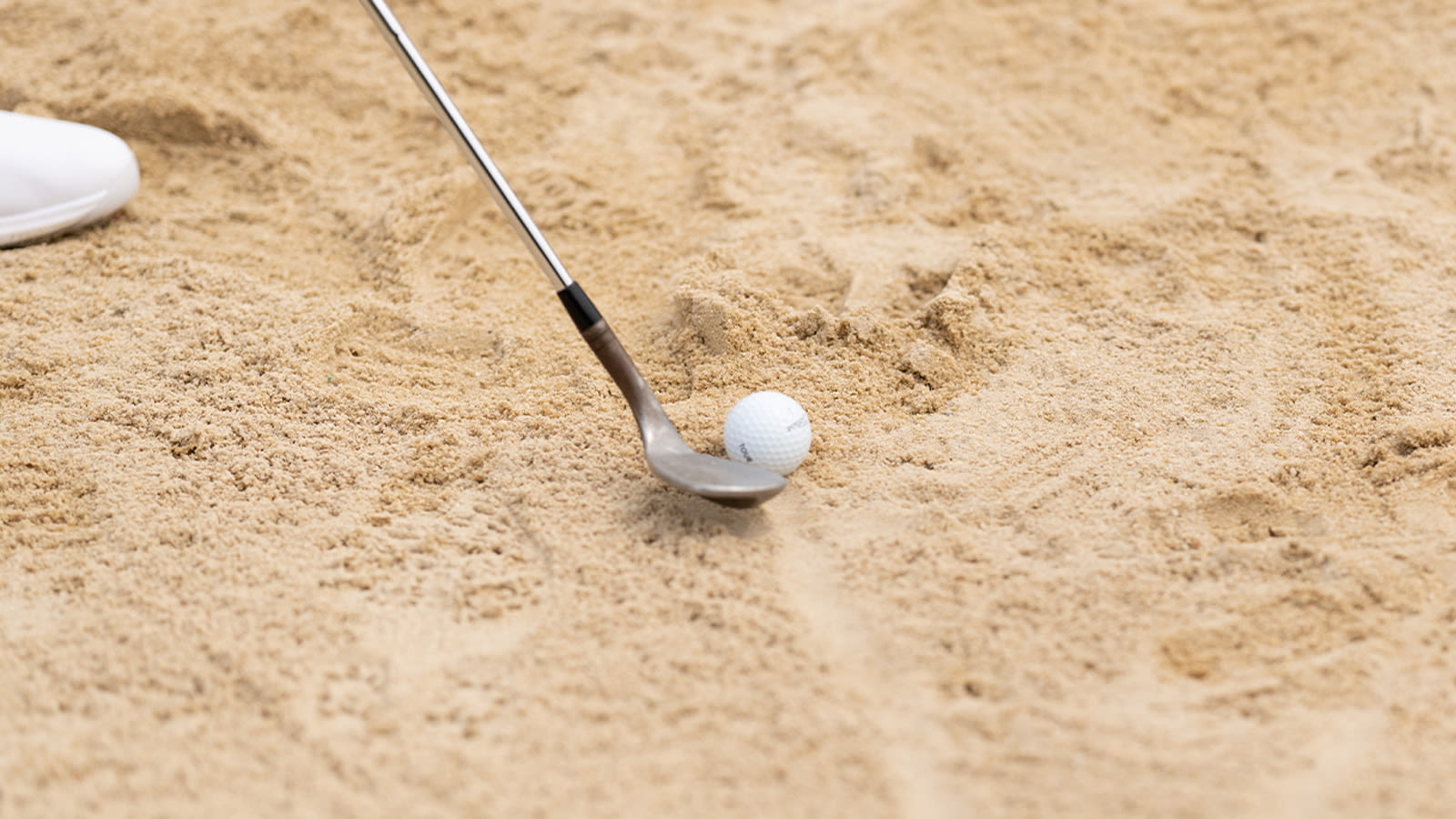 A view of how a sand wedge sits in the bunker at 2022 PGA Championship held at Southern Hills Country Club on May 17, 2022 in Tulsa, Oklahoma. (Photo by Darren Carroll/PGA of America)