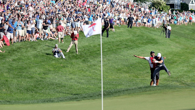 Jordan Spieth and caddy Michael Greller authored an epic Travelers Championship moment in 2017.  (Tim Clayton/Corbis via Getty Images)