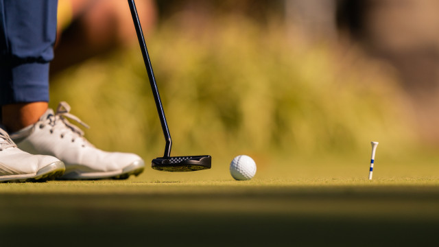 A contestant lines her putter to the golf ball on the practice greens during the second round of the 2020 KPMG Women's PGA Championship at Aronimink Golf Club on October 9, 2020 in Newtown Square, Pennsylvania. (Photo by Darren Carroll/PGA of America)