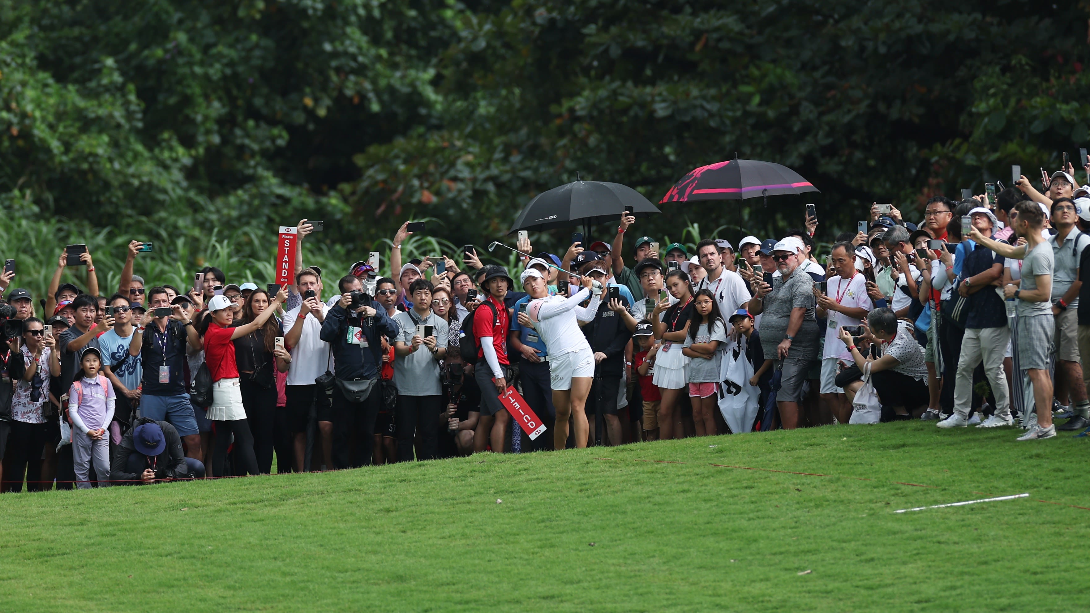  Jin Young Ko plays her second shot on the 18th hole during the final round of the 2023 HSBC Women's World Championship at Sentosa Golf Club in Singapore. (Photo by Lionel Ng/Getty Images)