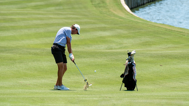 Shift Your Weight to Make Solid Impact When the Golf Ball is Below Your Feet