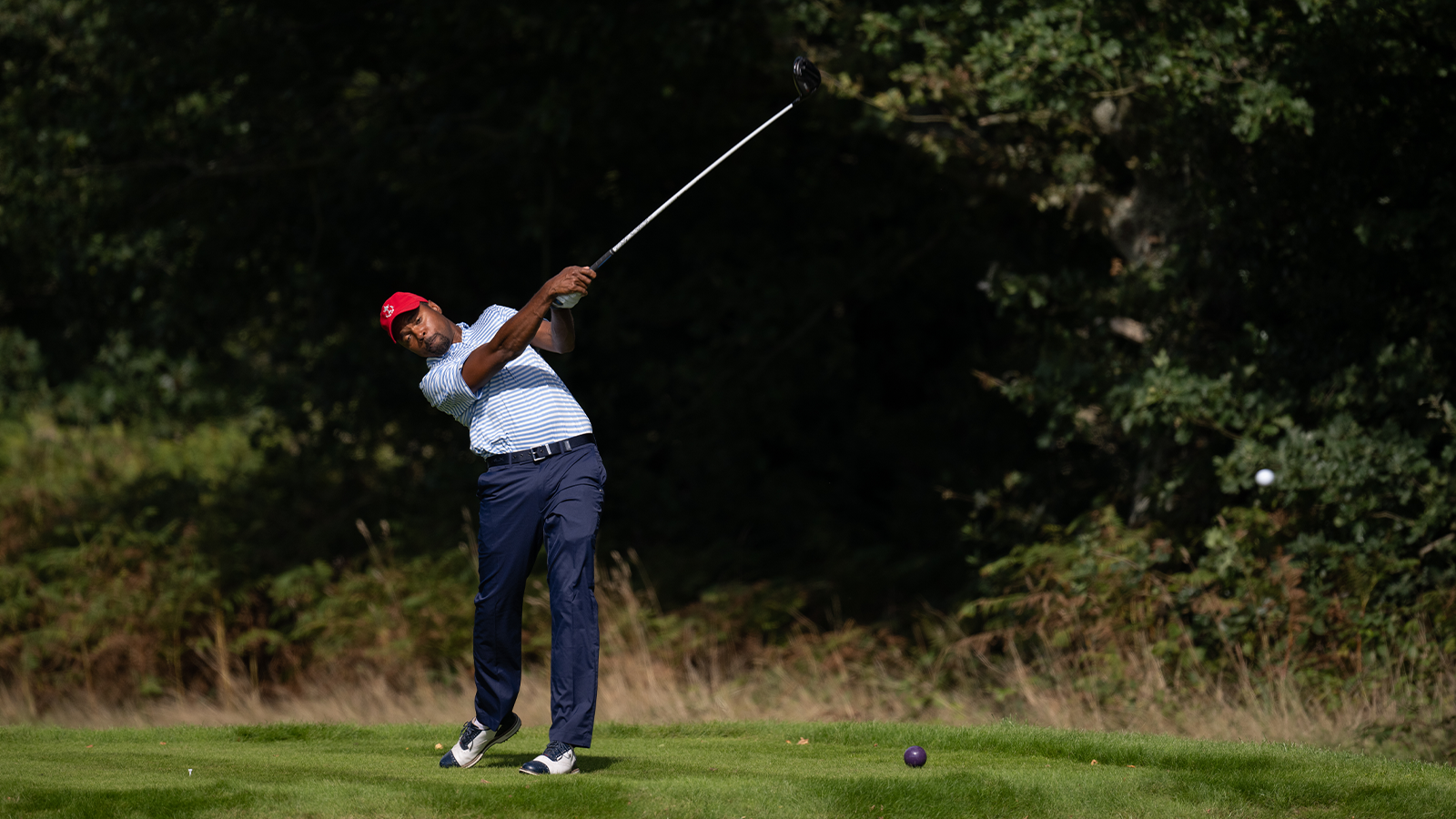 Wyatt Worthington II of the United States hits his shot during the 30th PGA Cup at Foxhills Golf Club on September 12, 2022 in Ottershaw, England. (Photo by Matthew Harris/PGA of America)