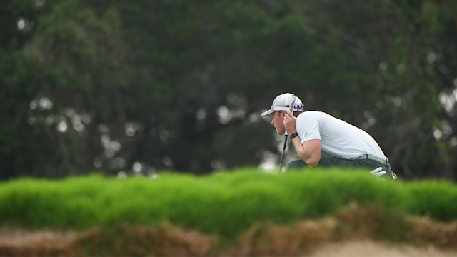 Brandon Bingaman reads his putt on the on the 13th green at the PGA Professional Championship.
