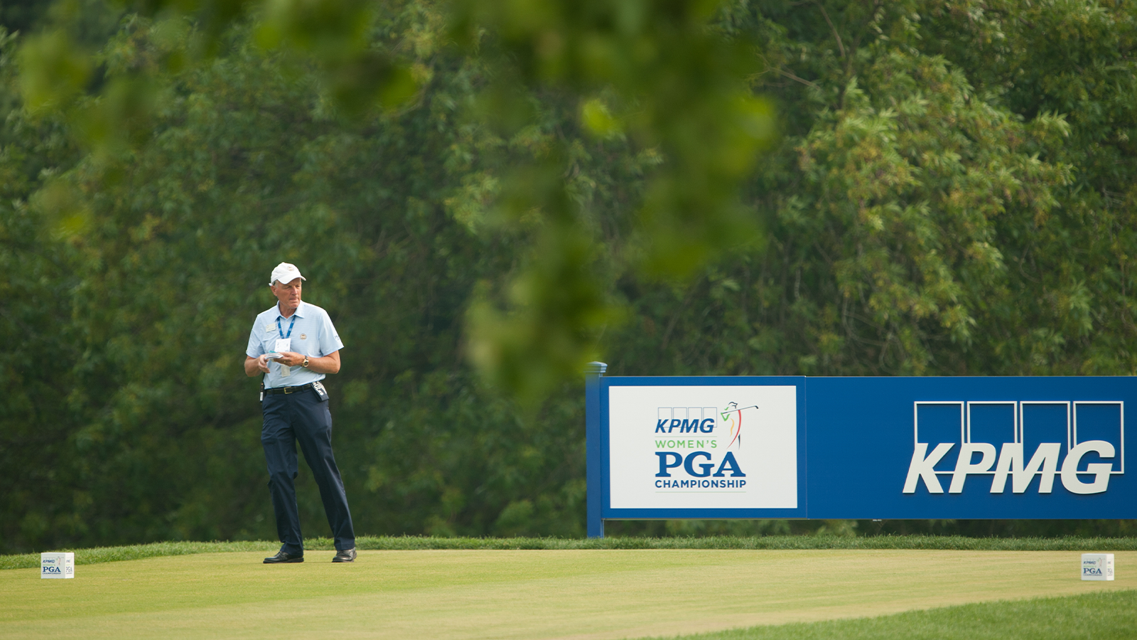 PGA of America CCO, Kerry Haigh, checks yardages on eighteen during Round One at the 2015 KPMG Women's PGA Championship held at Westchester Country Club on Thursday, June 11, 2015 in Harrison, New York. (Photo by Montana Pritchard/The PGA of America)