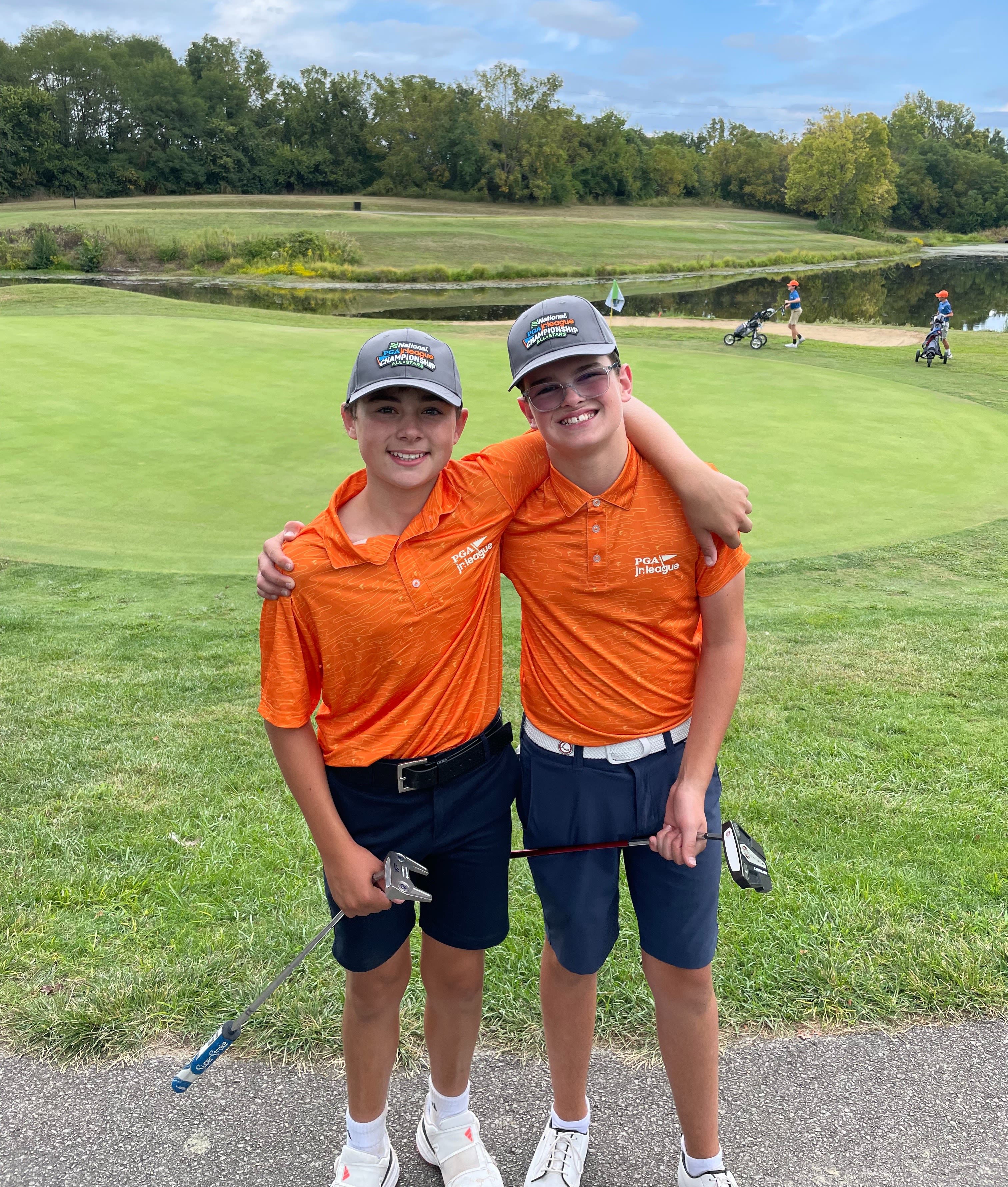 Peters (right) with a teammate during a PGA Jr. League match.