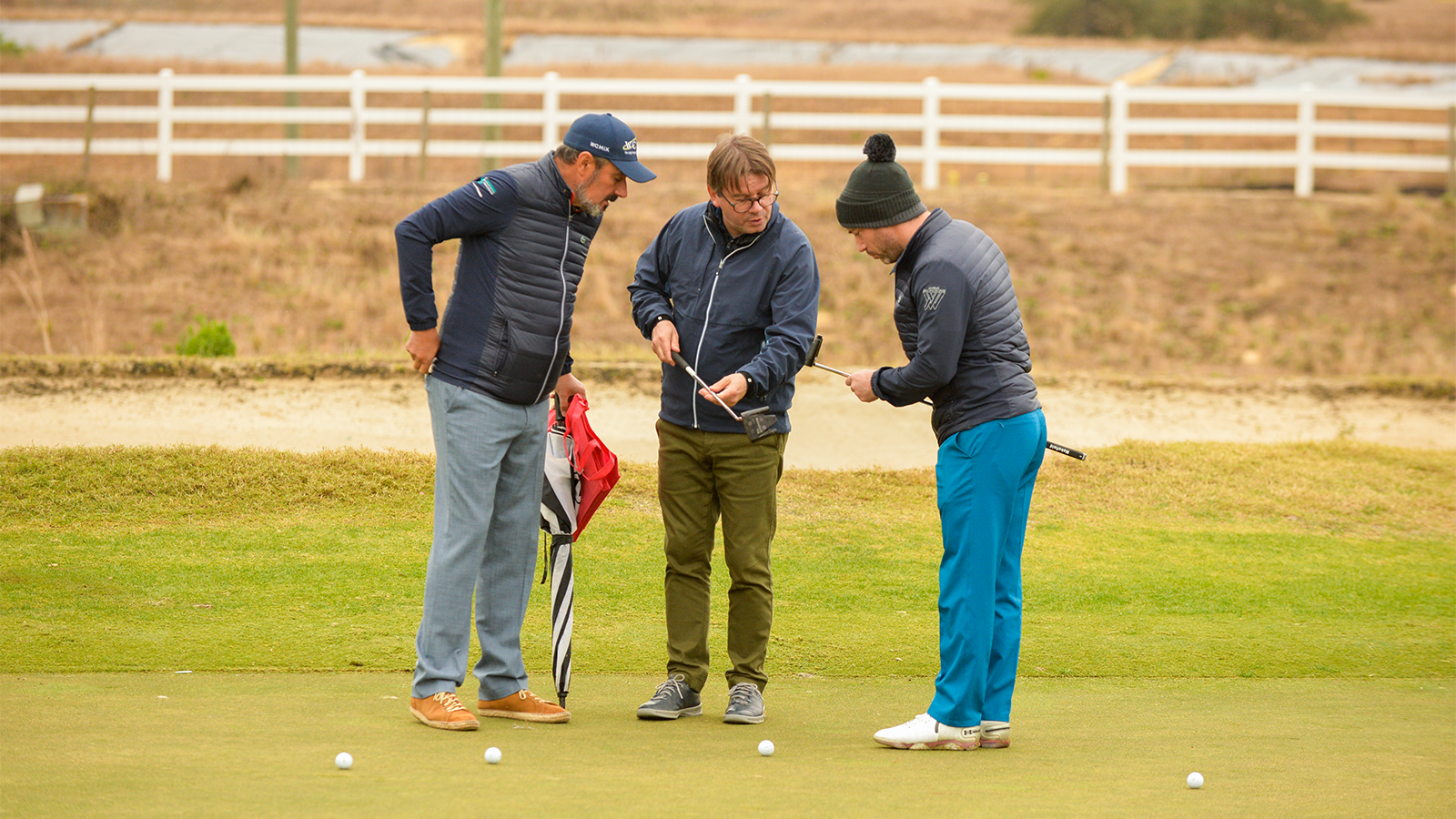 Attendees inspect putters on the putting green during DEMO day for the 2022 PGA Show at the Orange County National Golf Center on January 25, 2022 in Winter Garden, Florida. (Photo by Montana Pritchard/PGA of America)