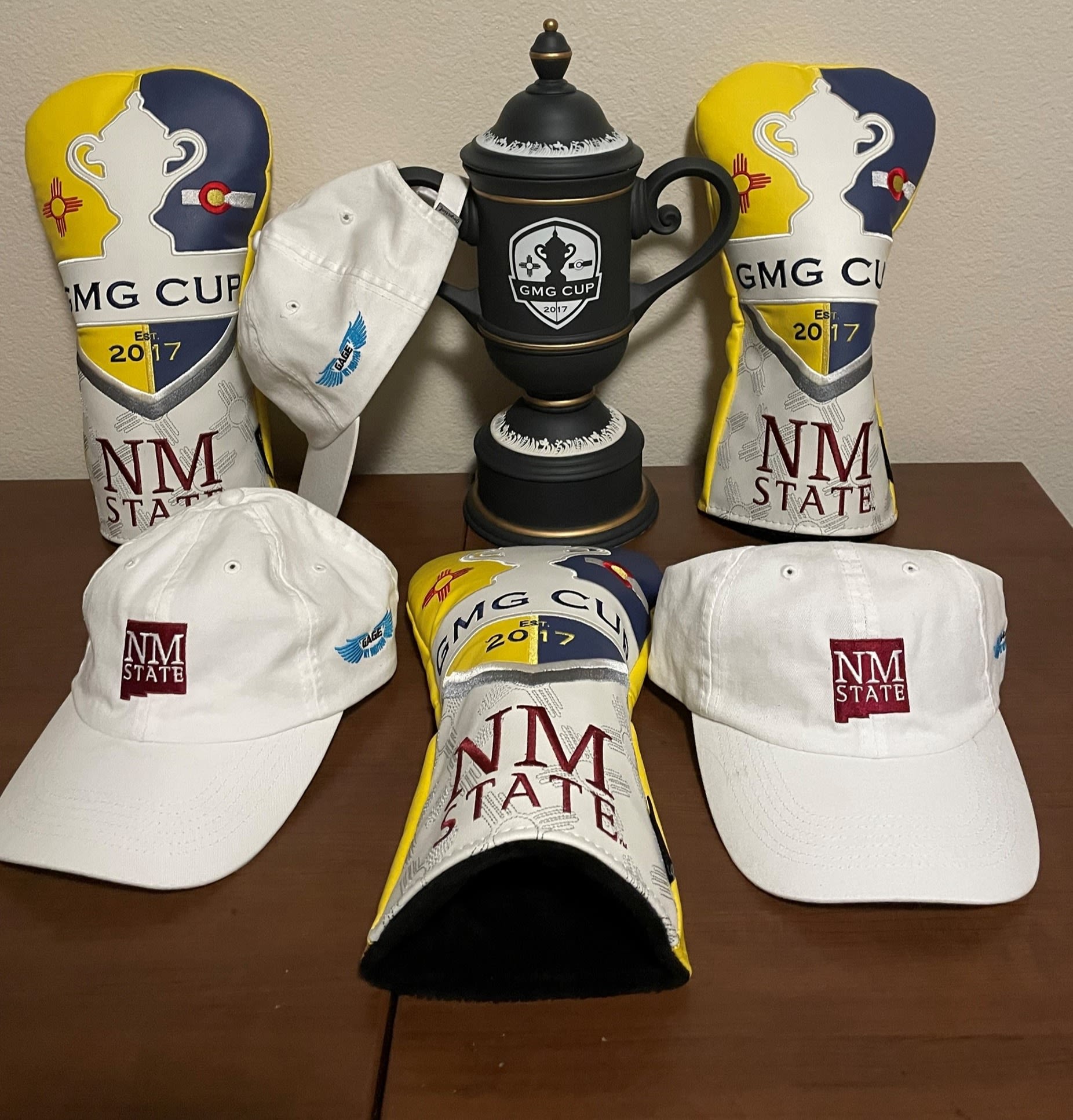 Custom GMG Cup headcovers with the cup itself.