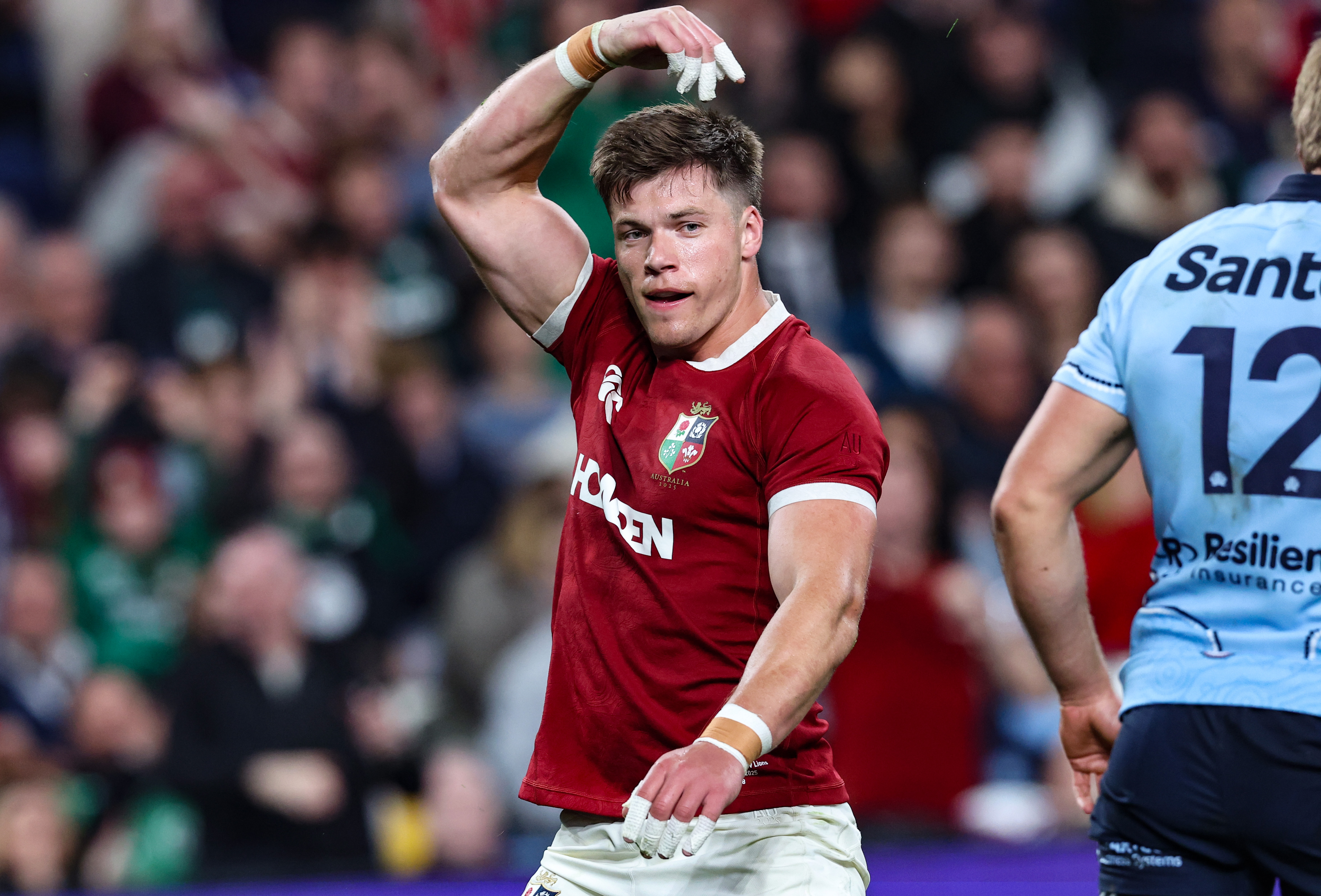 Huw Jones celebrates one of his tries against NSW Waratahs