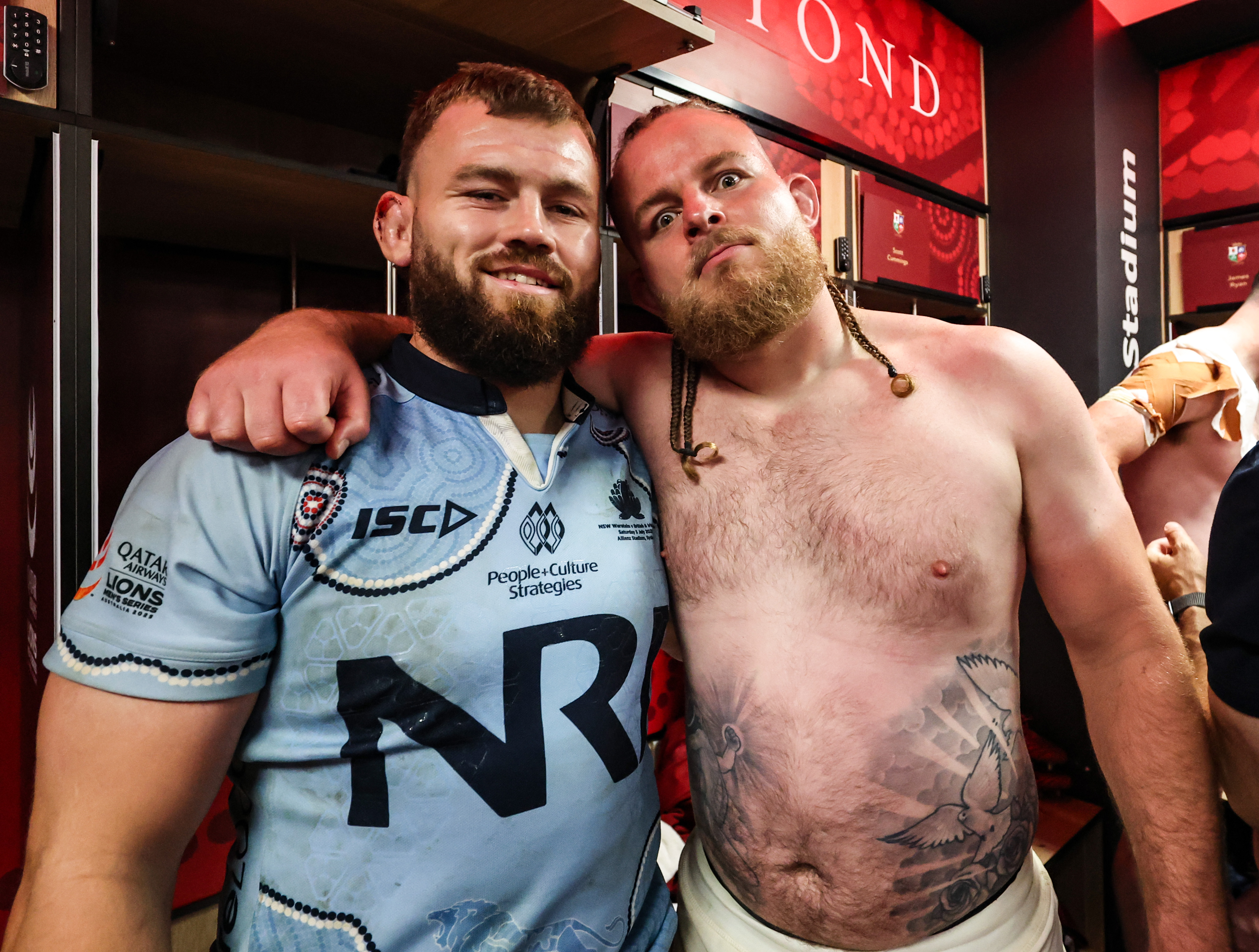 Luke Cowan-Dickie and Finlay Bealham celebrate in the changing rooms