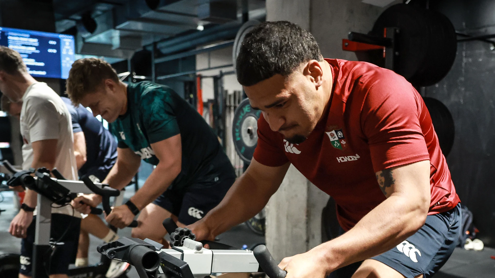 Sione Tuipulotu on the exercise bike