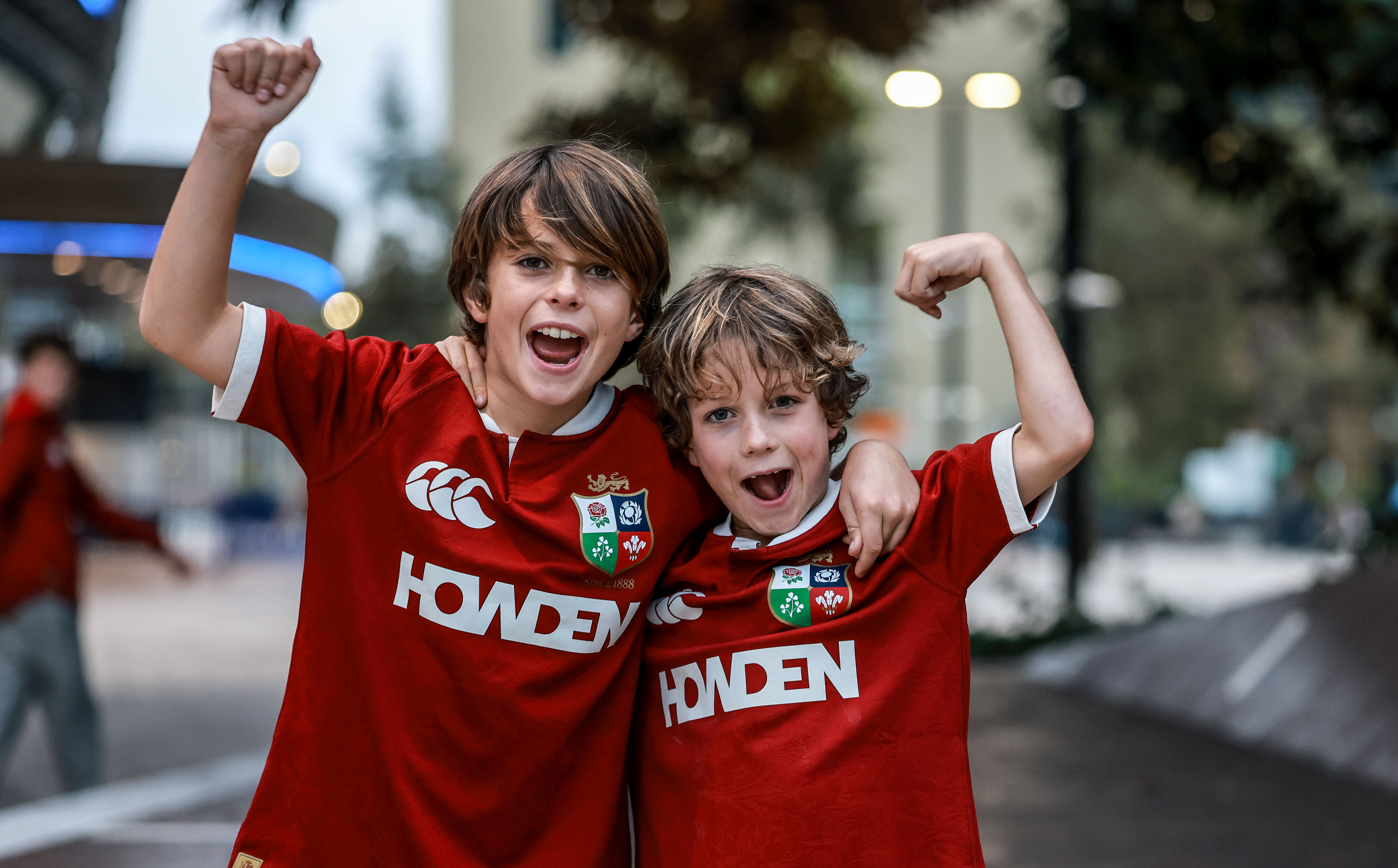 Two young Lions fans get ready for kick-off