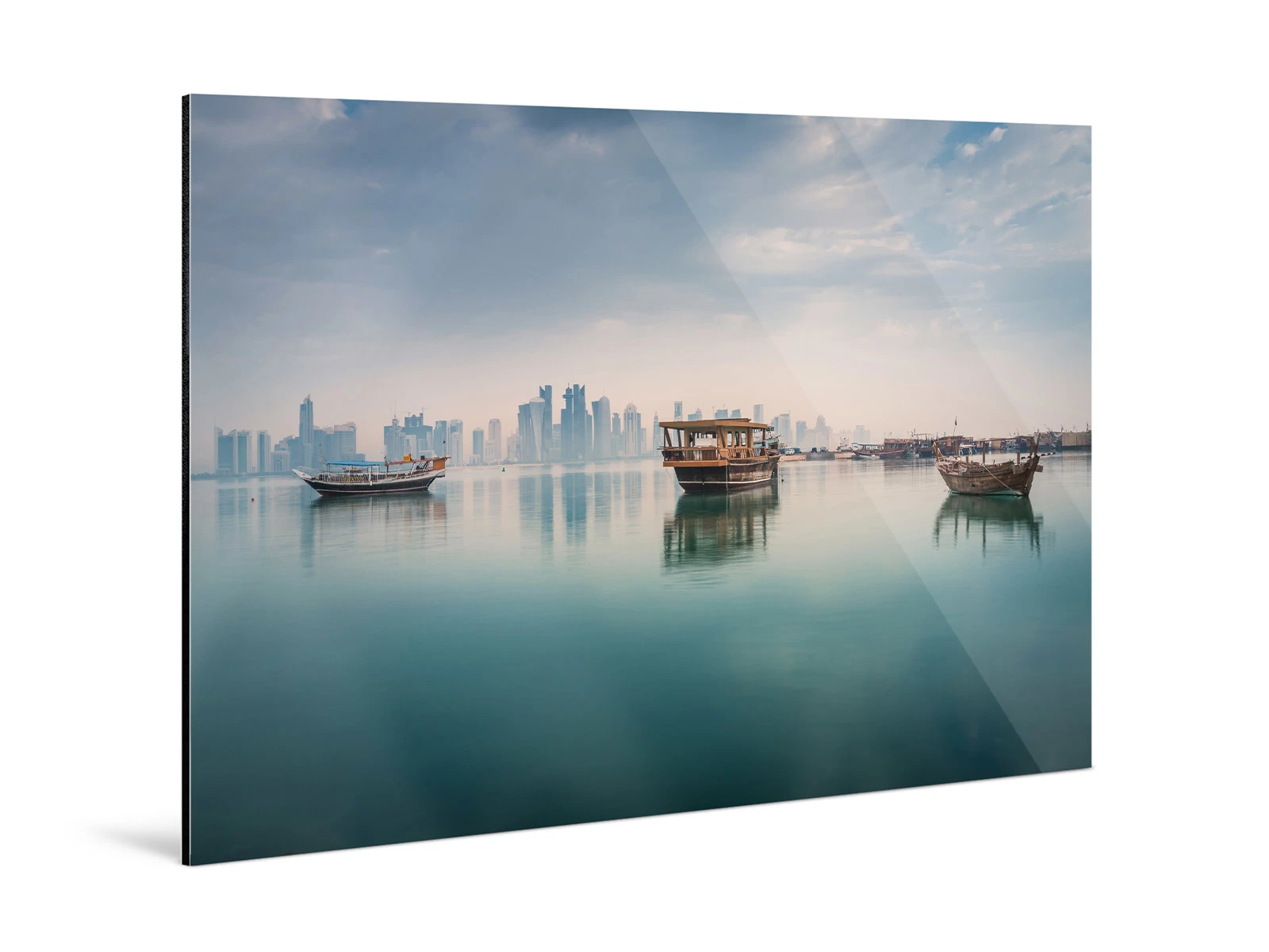 Three boats reflected on the calm sea surface, while in the background is a skyline on a Photo Print On Aluminum Backing.