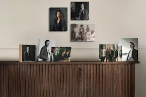 Photo products showing corporate photos displayed on a sideboard.