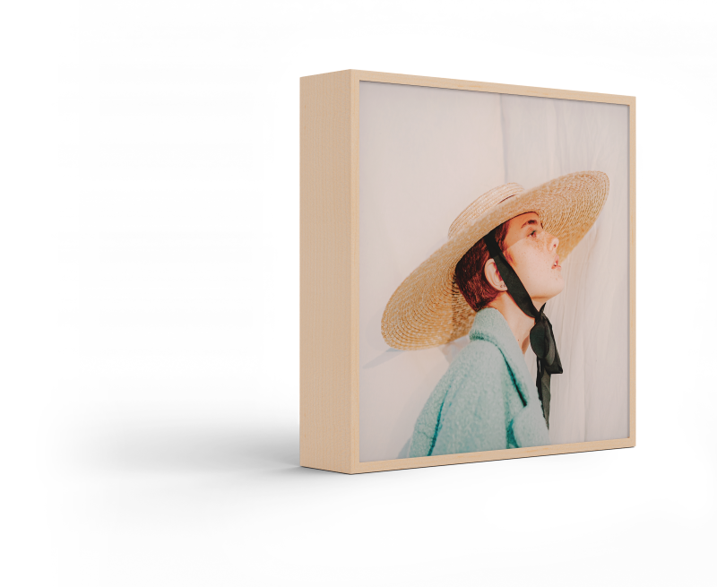 Standing ArtBox with frame color Natural maple against a white background.