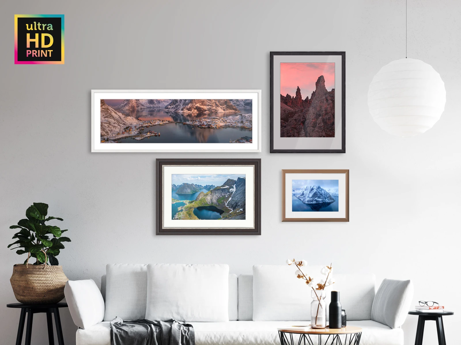 several metallic ultraHD photo prints on Fuji Crystal Pearl paper in frames hanging on a wall.
