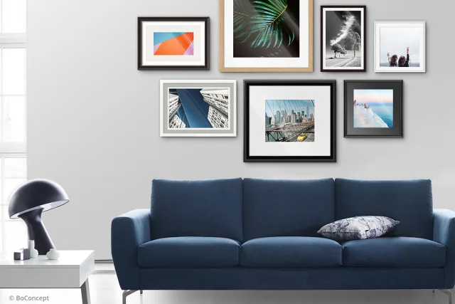 Couch in front of Passepartouts Images.