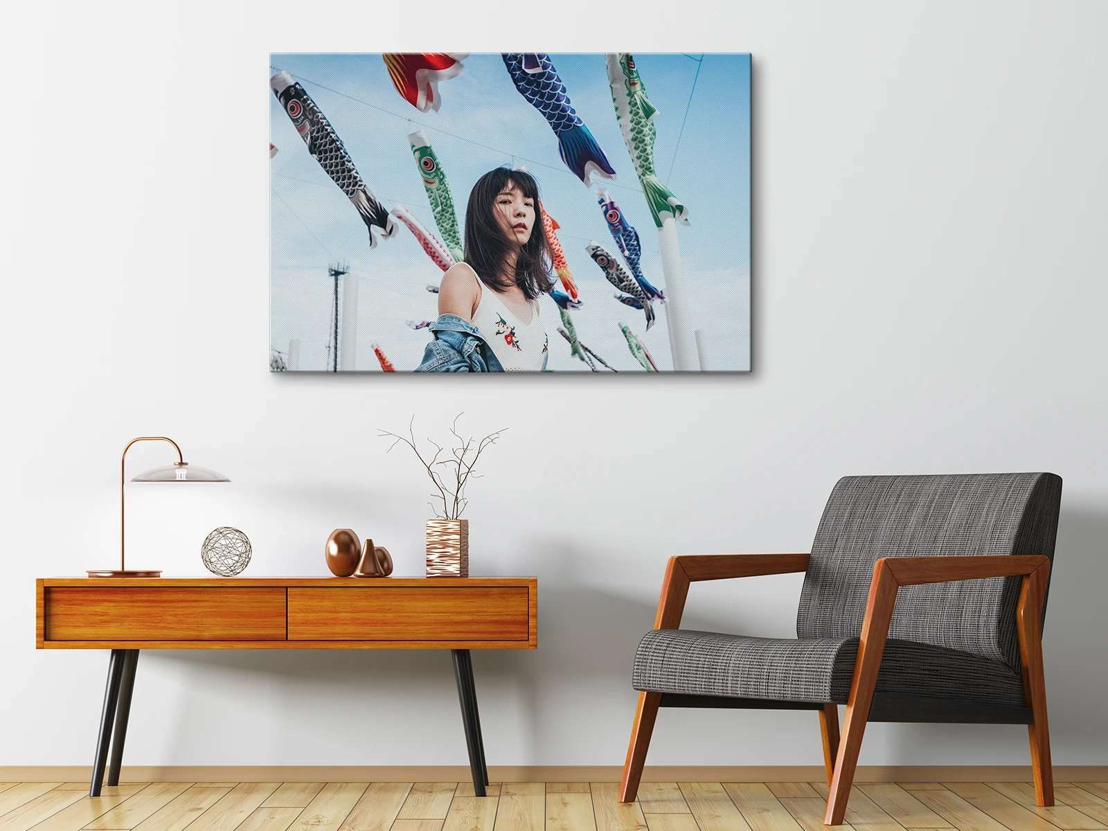 woman standing in front of lanterns as a matte canvas print on a stretcher frame hanging on a wall.
