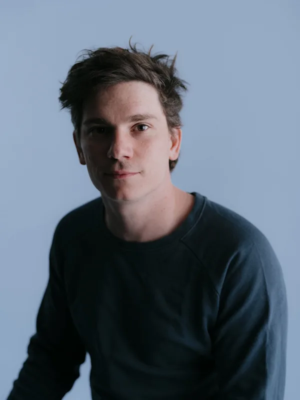 Young man looking towards the camera.