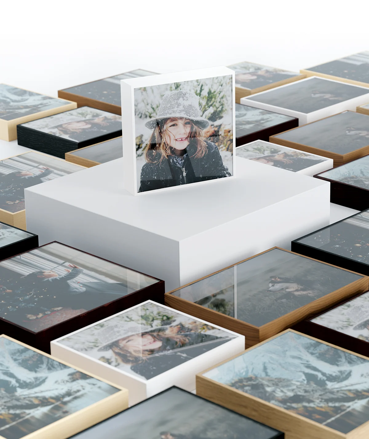 Several ArtBox variations lying on a floor, one ArtBox standing on a pedestal in the middle.