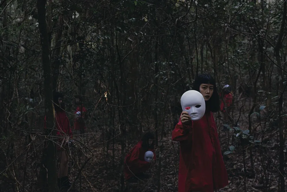 woman in forest and with a mask