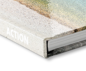 Corner view of a coffee table book with a glossy cover