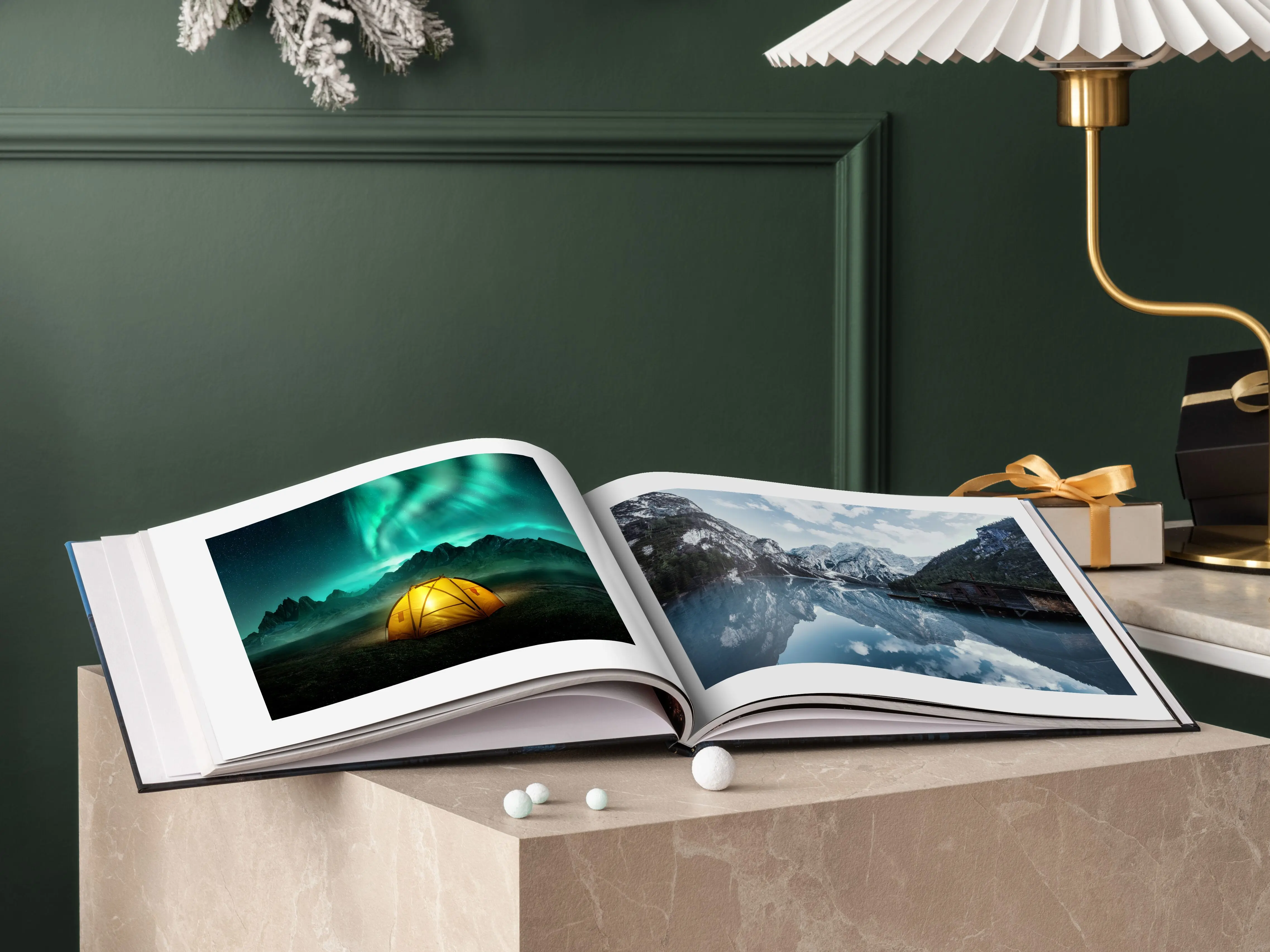 whitewall coffee table book with winter motifs lying opened on a table.