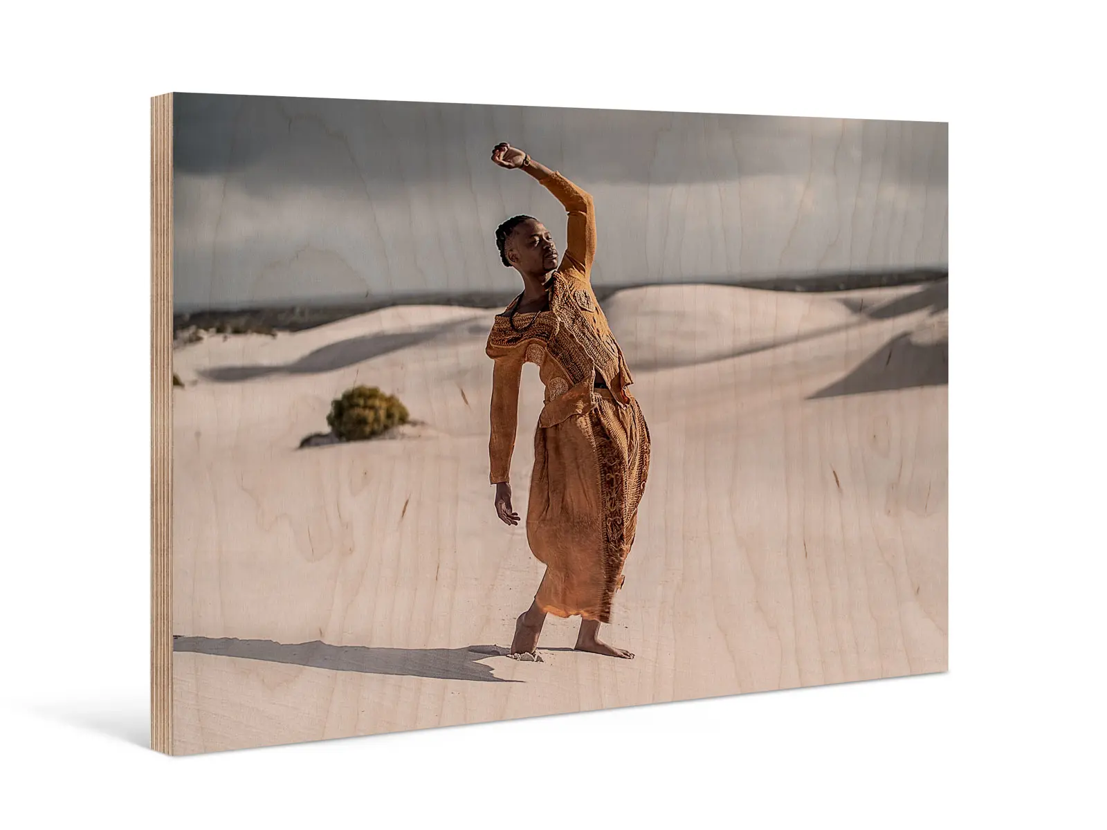 A person stands in front of sand dunes in a desert on a Direct Print on Wood.