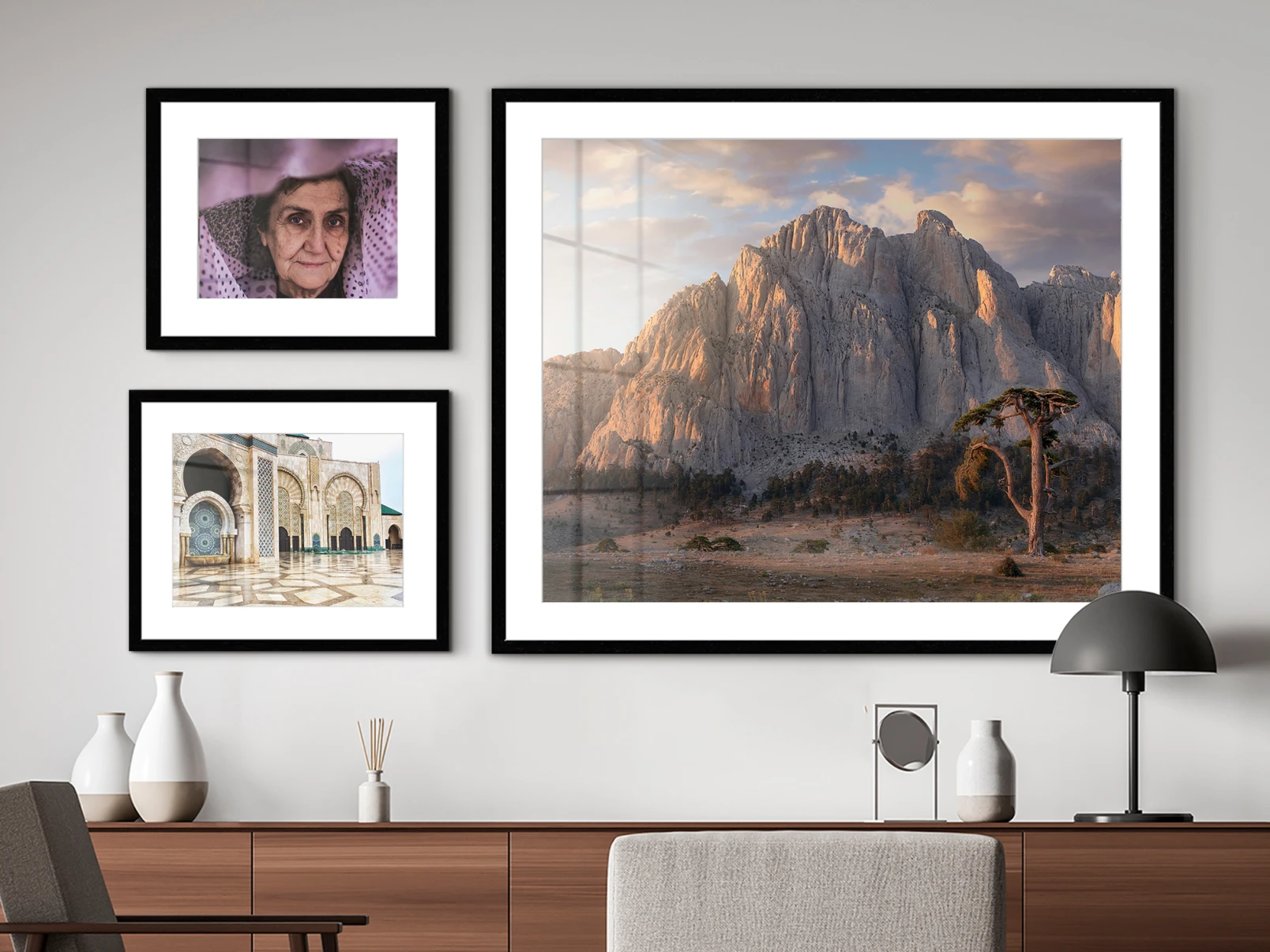 multiple hahnemühle fine art prints in matted frames hanging on a wall.