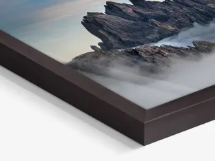 Close up of an overcast cloud in a mountain range in a Gallery Frame. 