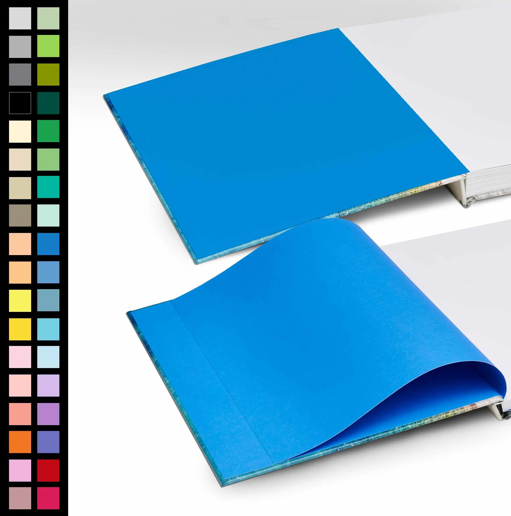 Deux Beau-Livre ouverts, avec des pages bleues sur fond blanc. Plusieurs couleurs au choix pour la page de gauche.