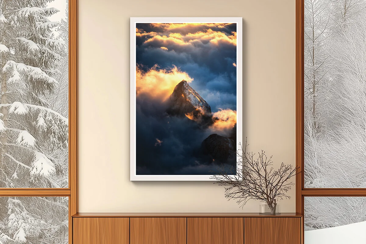 The Hamburg frame in white maple enhances the expression of the Fine Art Print on aluminum Dibond, sunlit clouds and mountain peak motif.