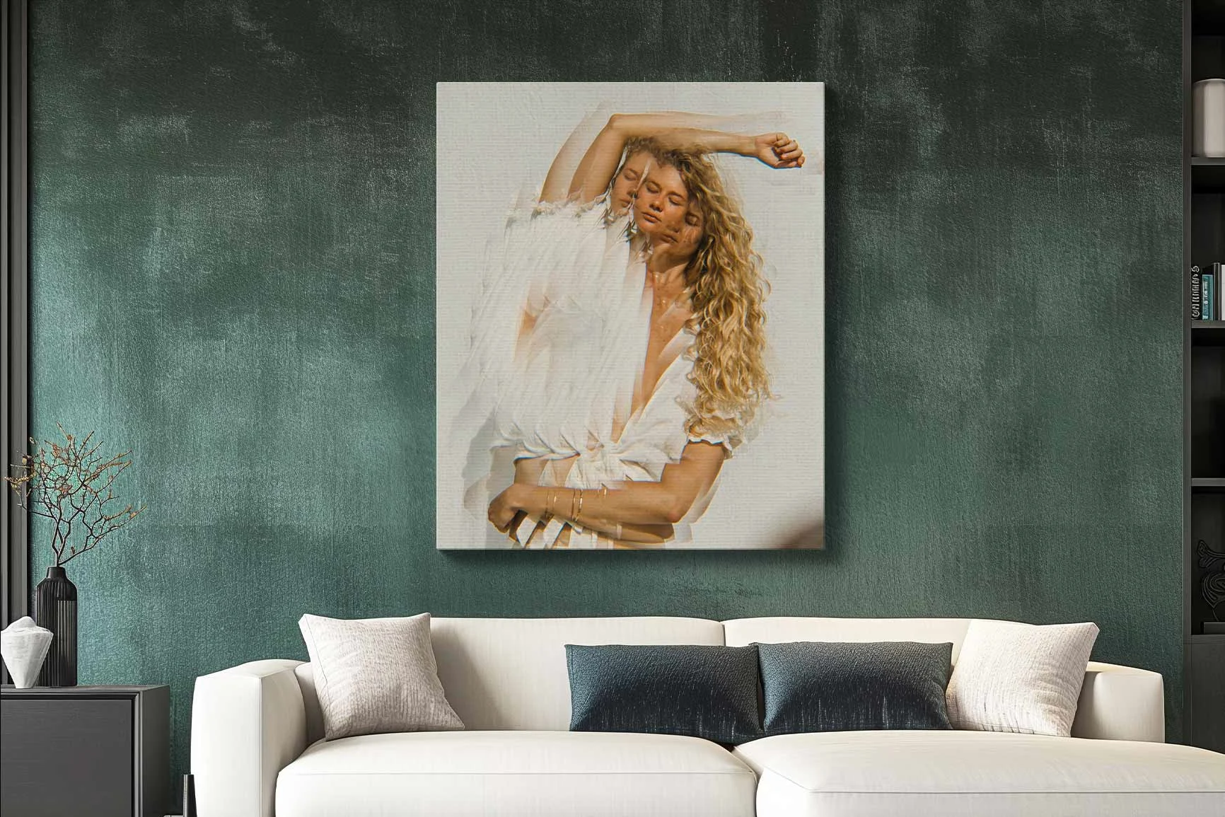 Mural of a blonde curly-haired woman in white clothes above a white sofa in front of a dark green wall.