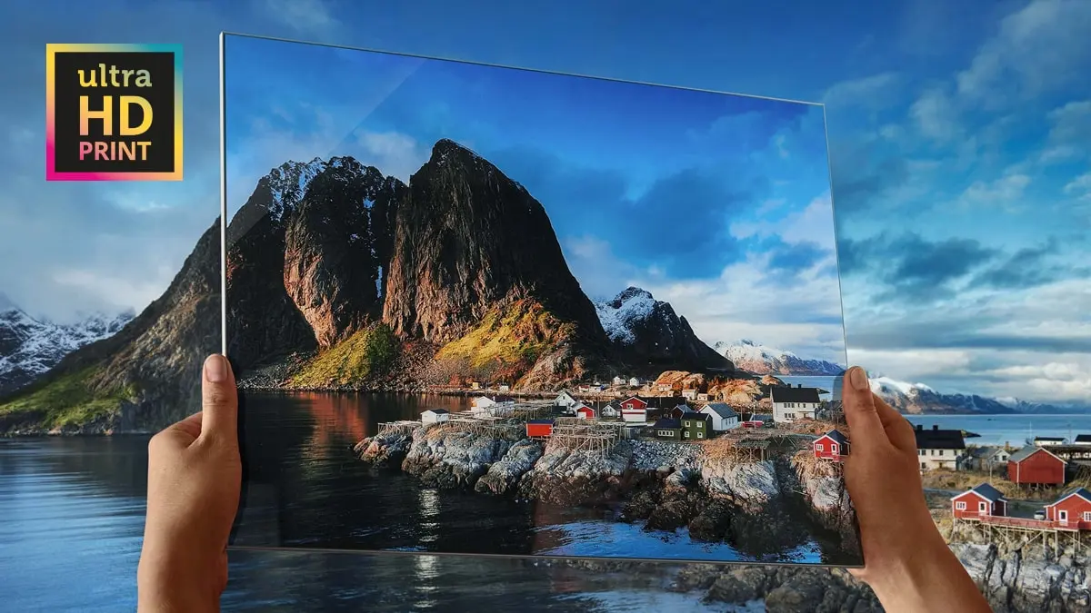 ultraHD print held in front of a landscape to demonstrate the sharpness of the resolution.