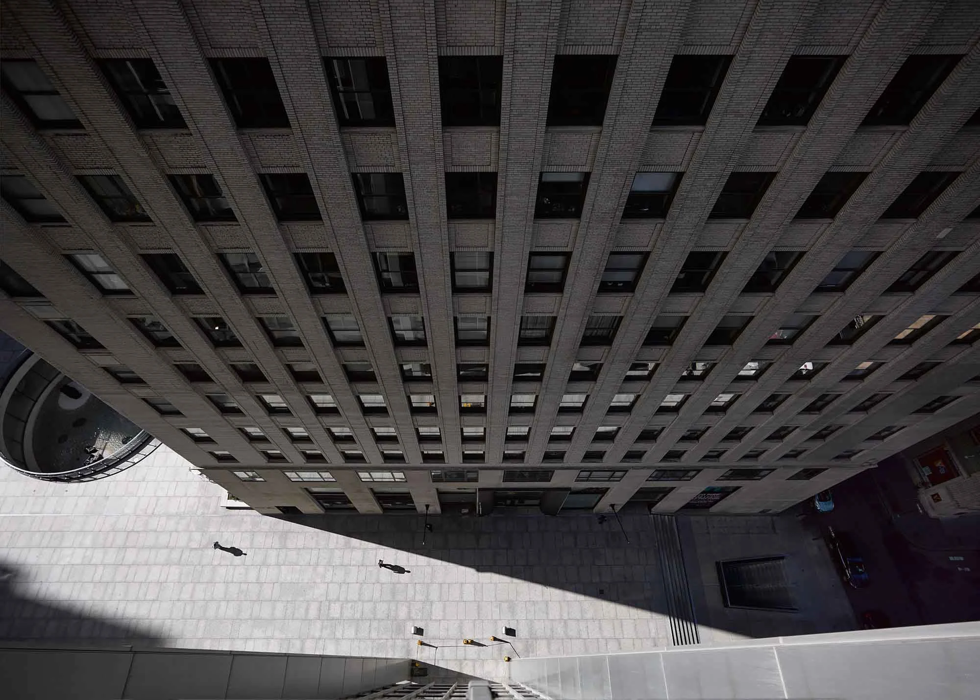 a new york building photographed from the opposite roof down.