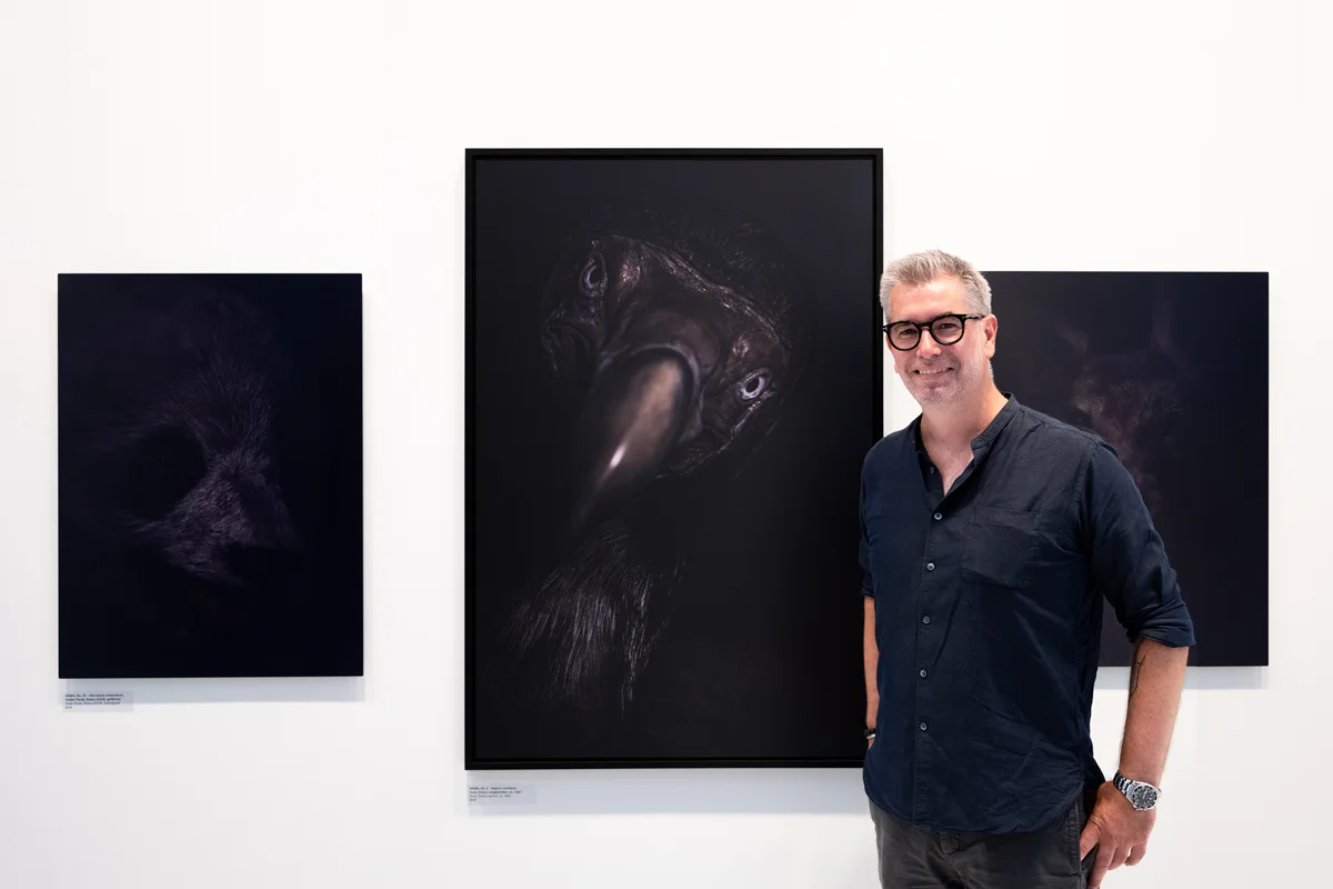 Florian W. Müller in front of his work at EQUILIBRIUM, his solo exhibition.