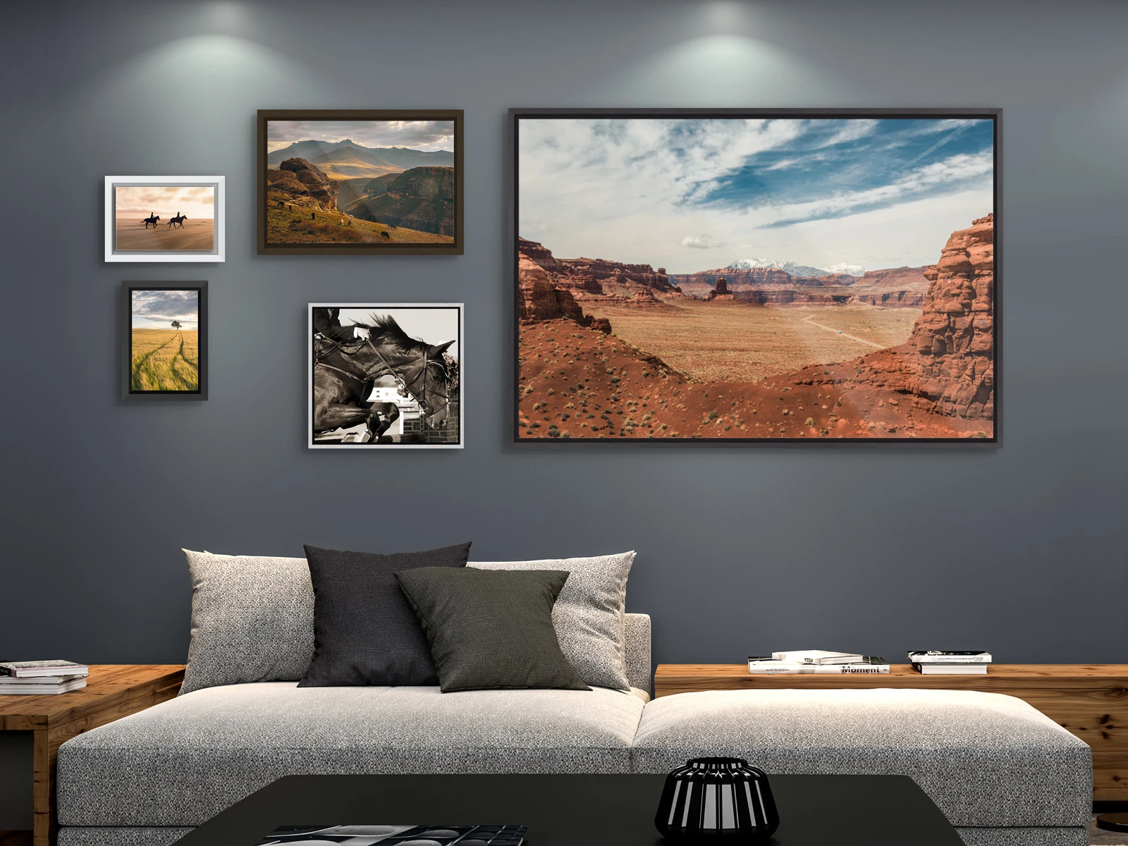 Several different motifs framed in a Floater Frame hang on a wall in a living room.