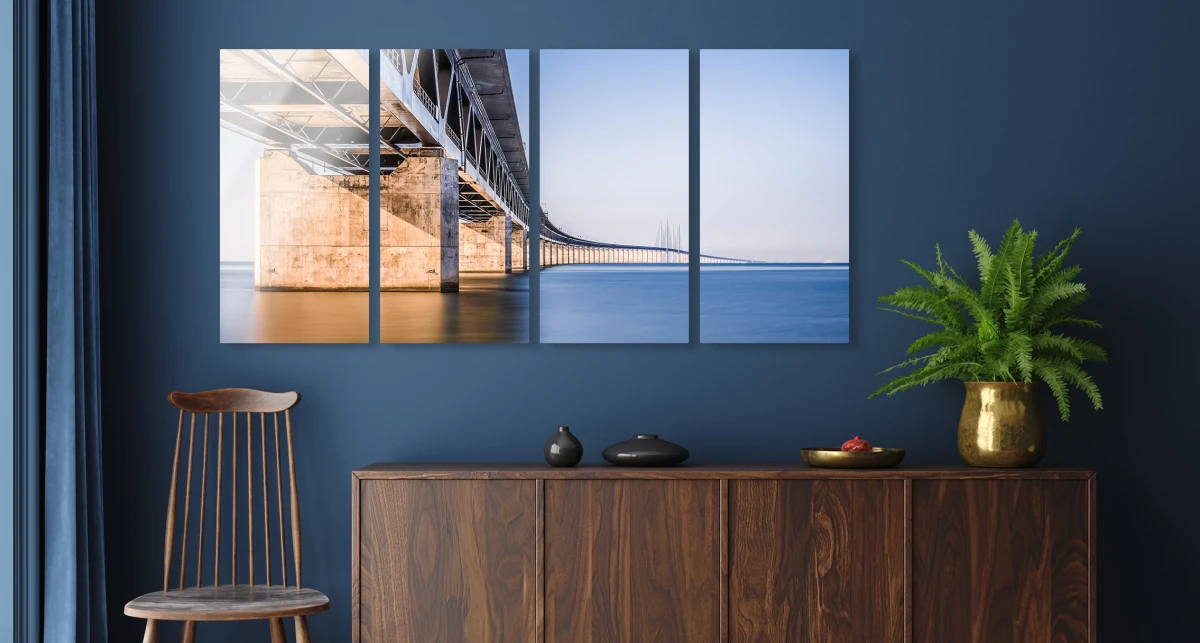 A bridge running through the sea. The whole picture is divided into four parts that hang vertically on the wall.