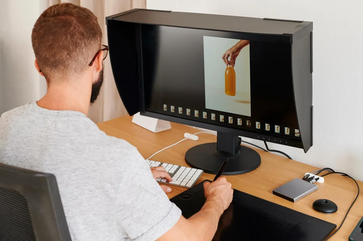 man editing on a computer.