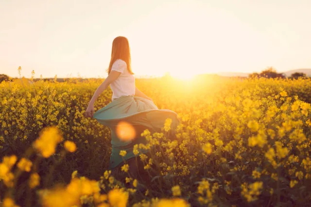 girl in the middle of a flower field.