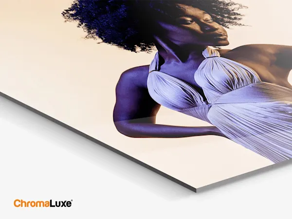 Woman in white dress on Chromaluxe print, glossy surface, motif shows intense contrast.